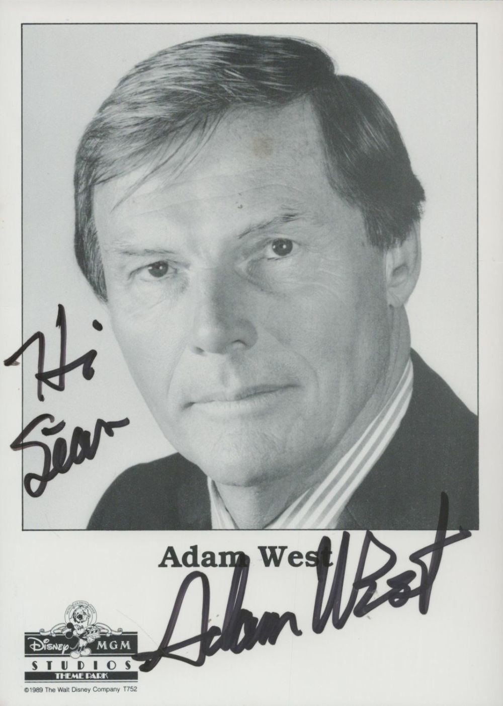 Lot 151: Adam West signed 7x5 inch Walt Disney black...