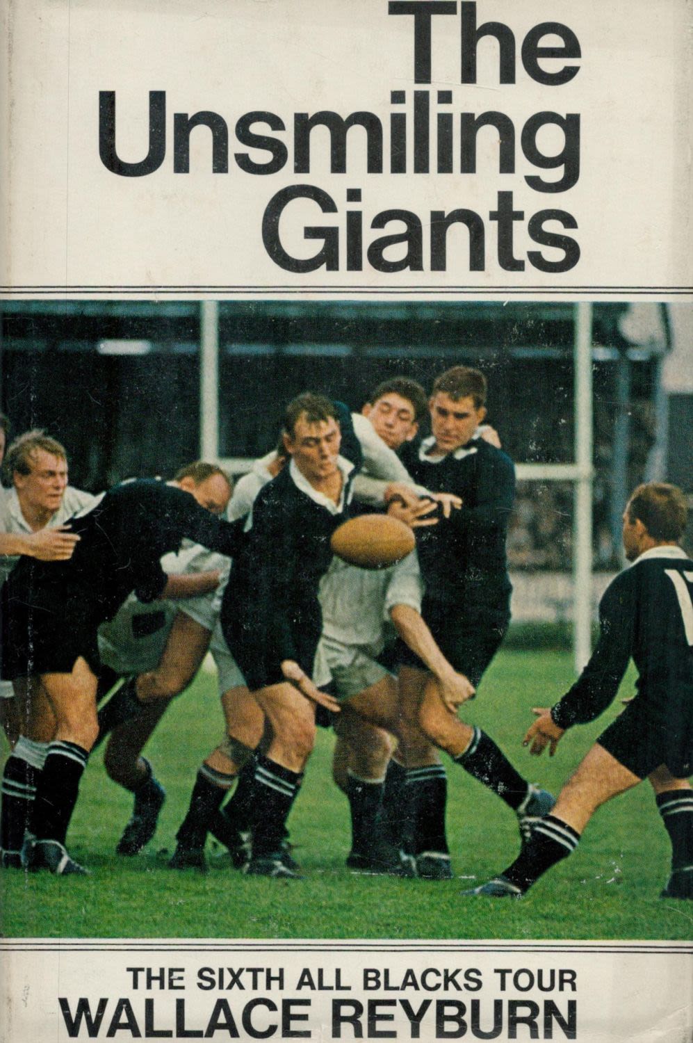 Lot 429: The Unsmiling giants by Wallace Reyburn hardback book....