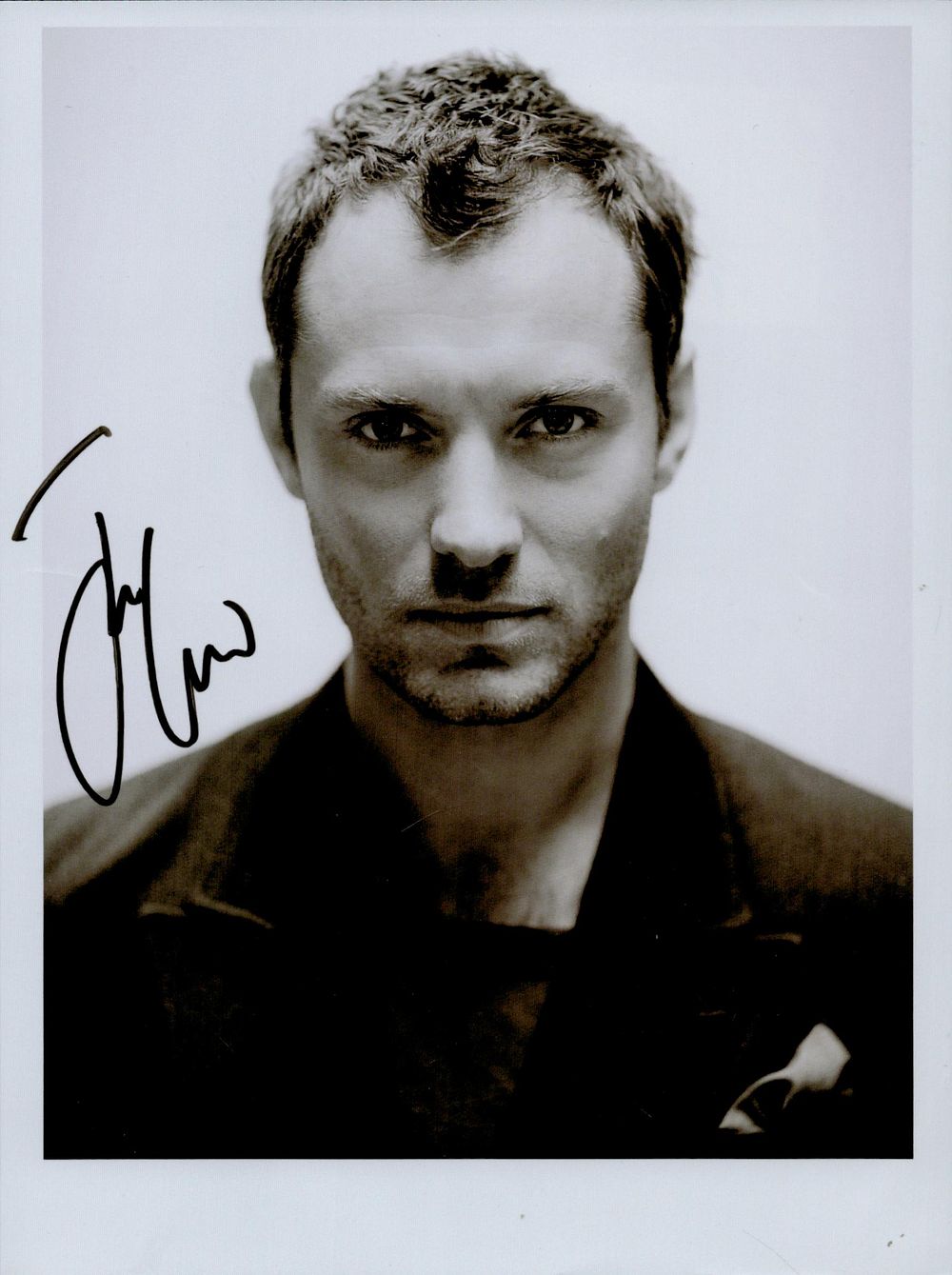 Lot 160: Jude Law signed 8x6inch black and white photo....