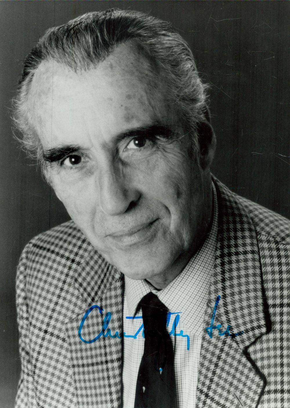 Lot 231: Christopher Lee signed 7x5 inch black and white...