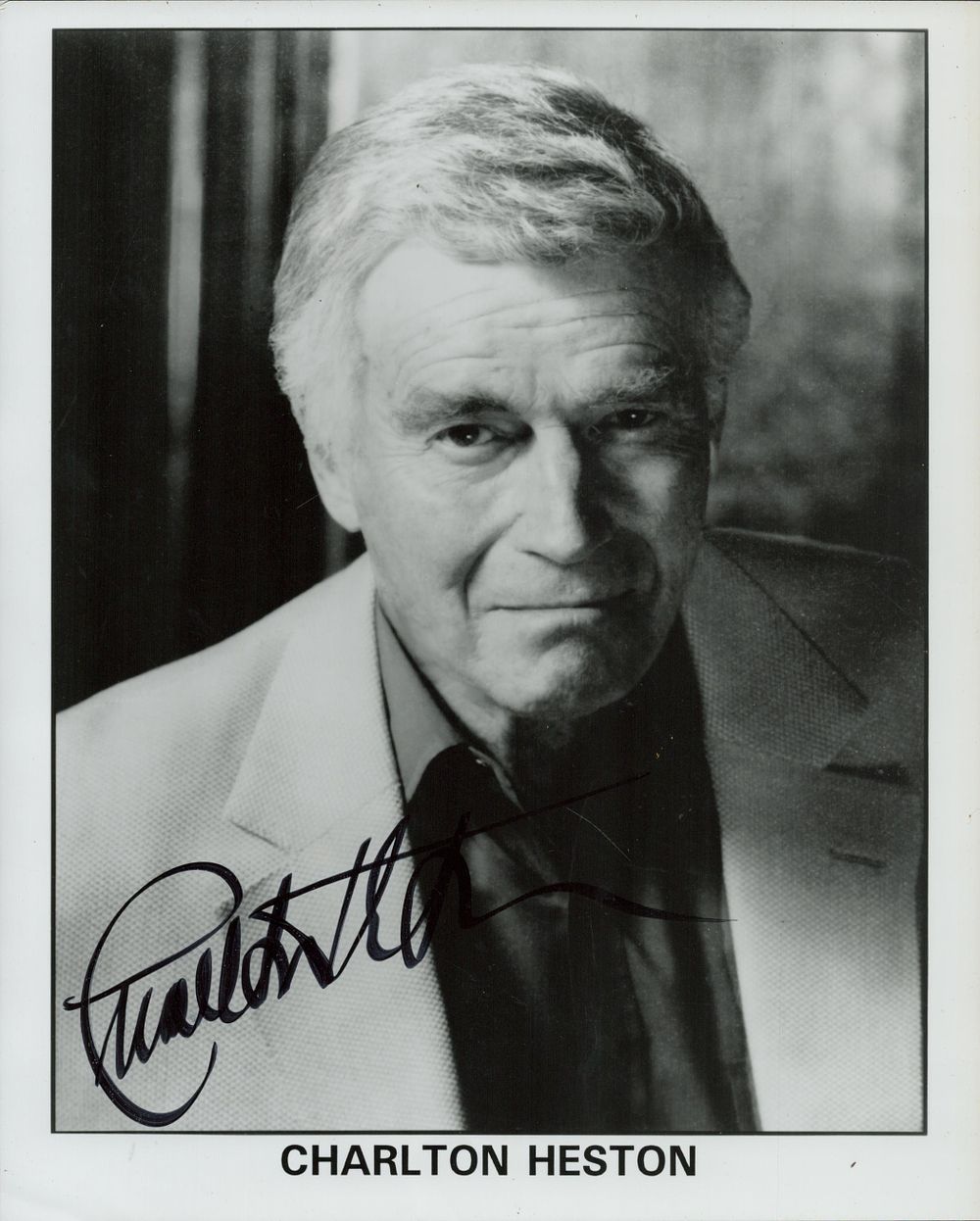 Lot 124: Charlton Heston signed 10x8inch black and white photo....