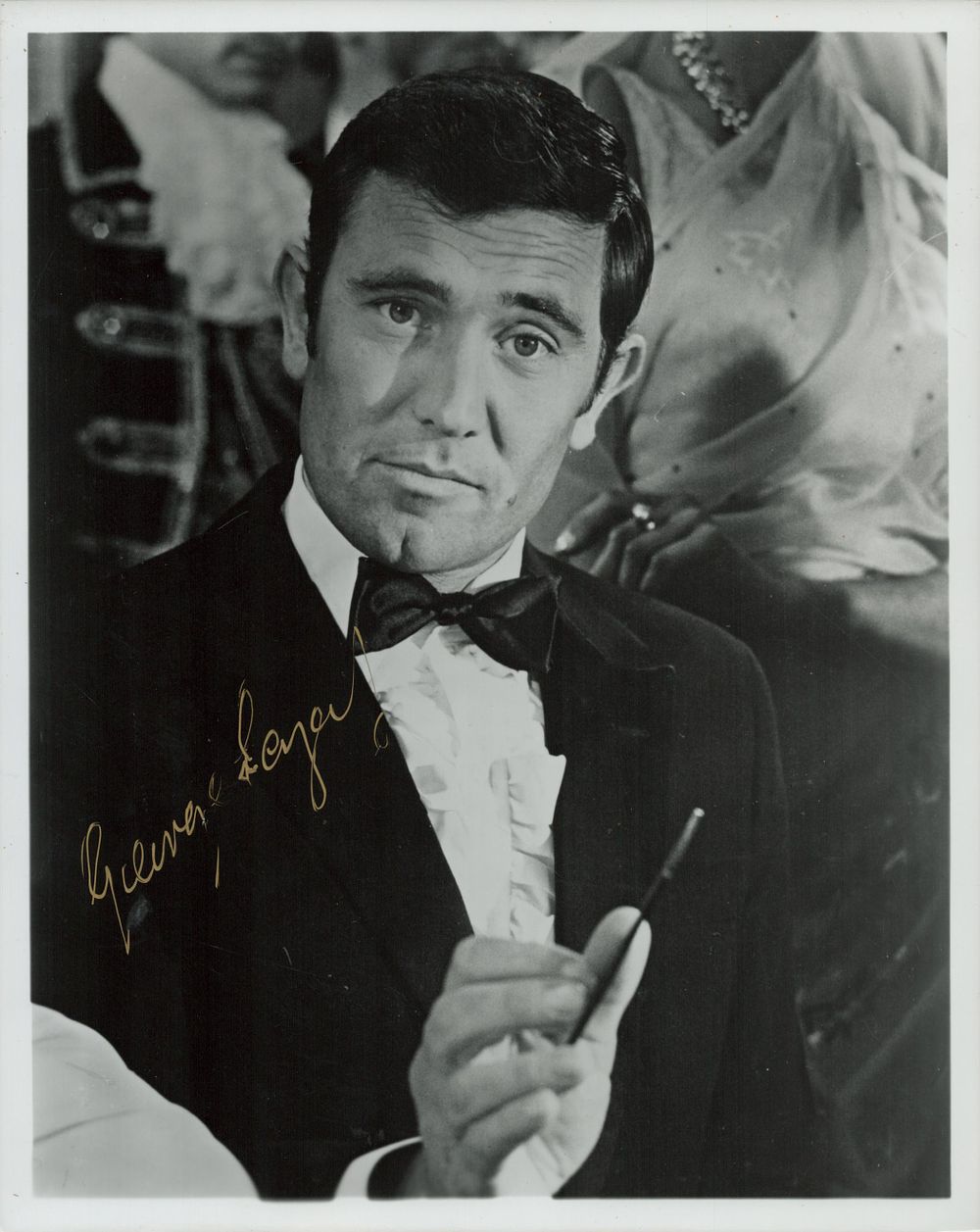 Lot 130: George Lazenby signed 10x8inch black and white photo....