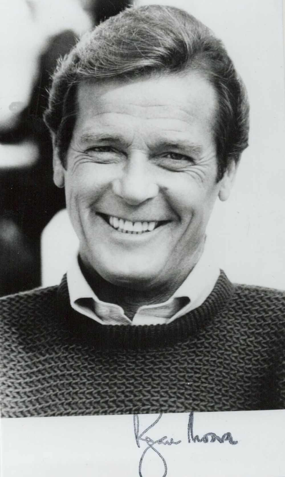 Lot 133: Roger Moore signed 6x4inch black and white photo....
