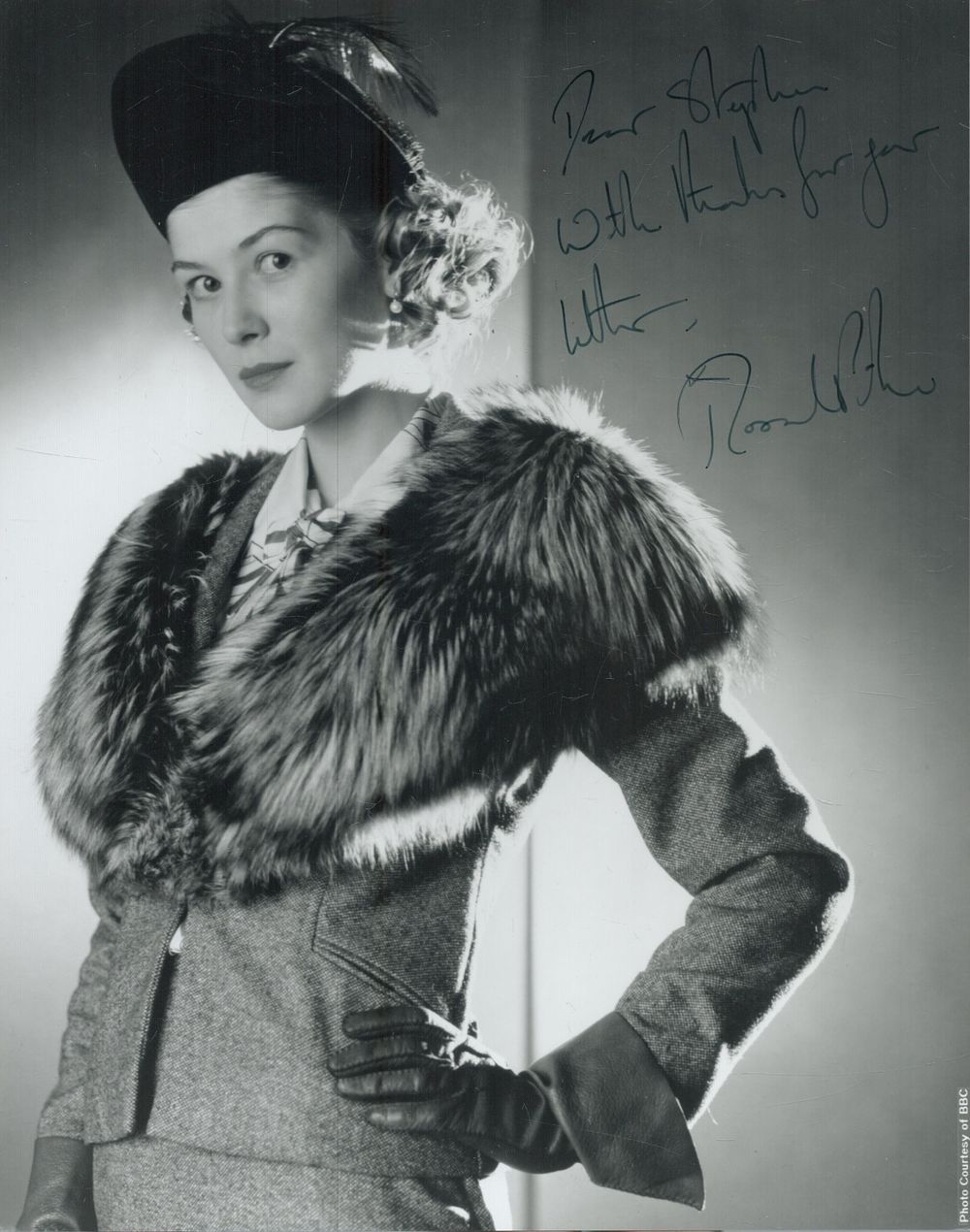 Lot 241: Rosamund Pike signed 10x8inch black and white photo....