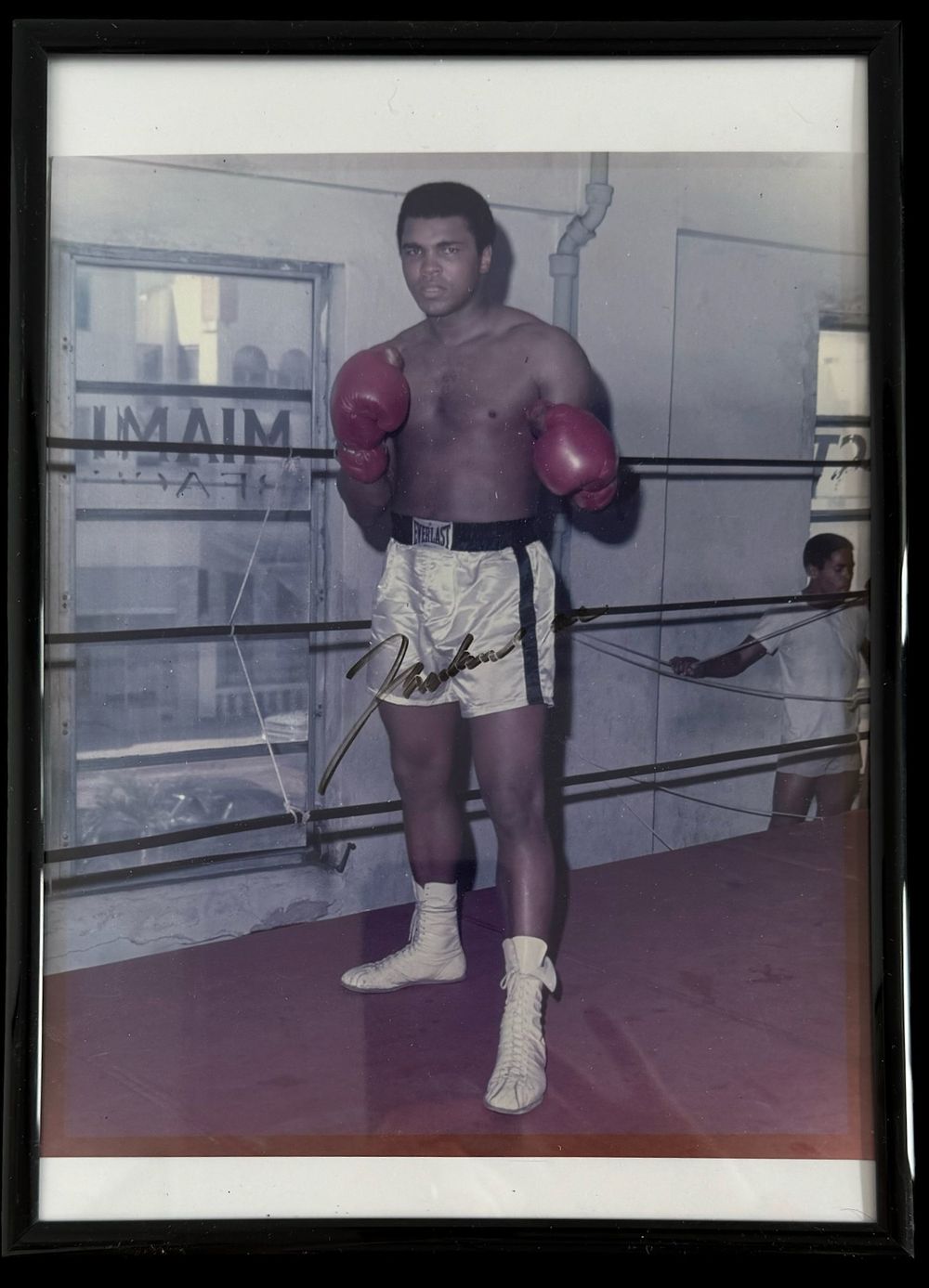 Lot 354: Muhammad Ali signed colour photo. Framed to approx...