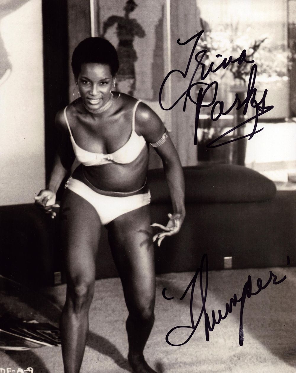 Lot 378: Trina Parks signed 10x8 inch James Bond black...