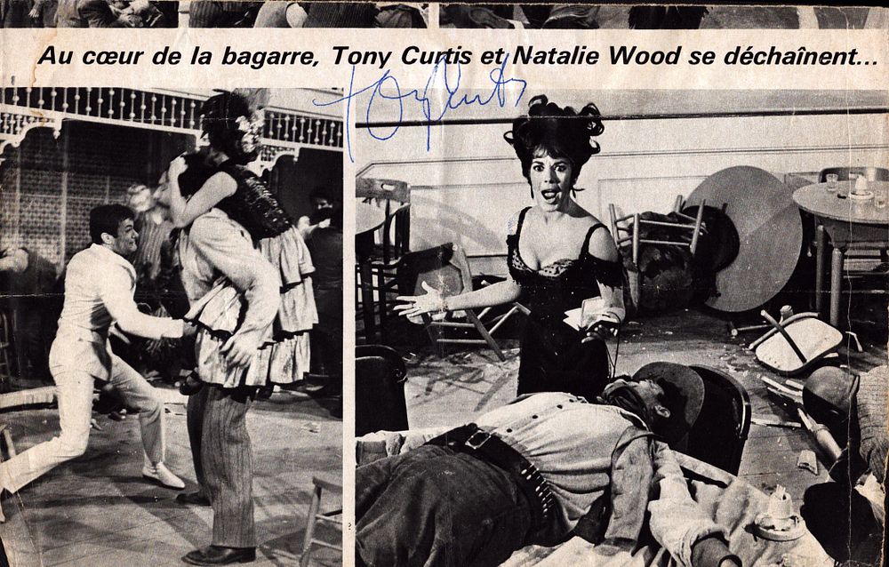 Lot 587: Tony Curtis signed 11x7 inch magazine page. Good...