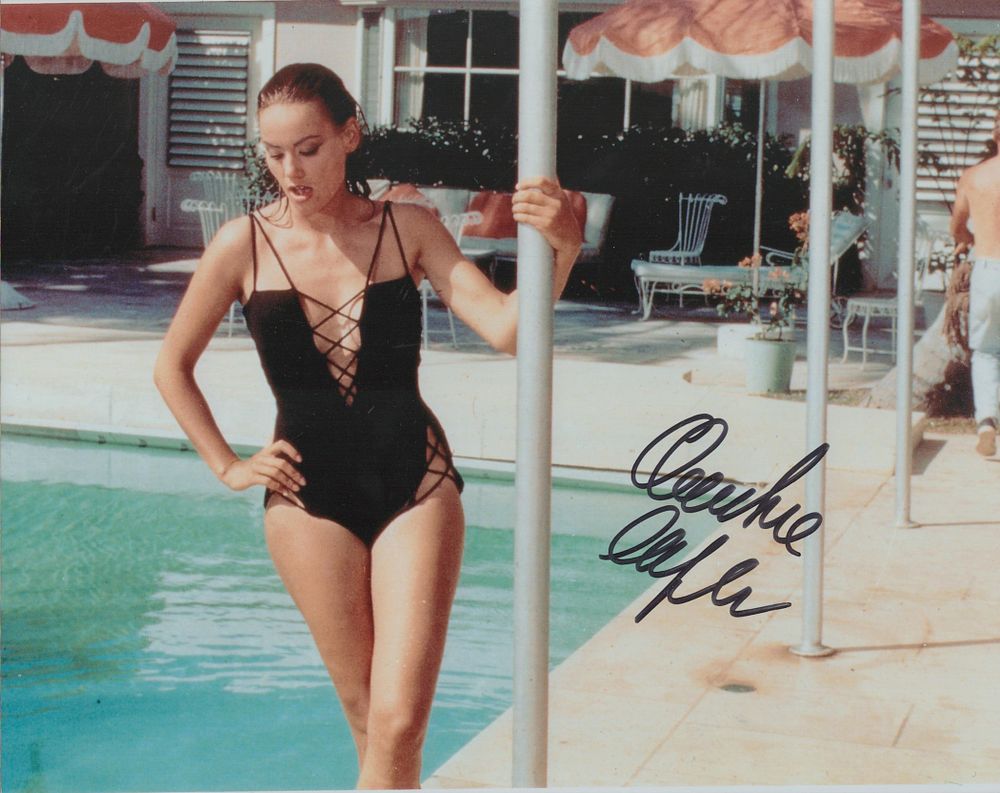 Lot 696: Claudine Auger signed colour photo 10x8 Inch as...