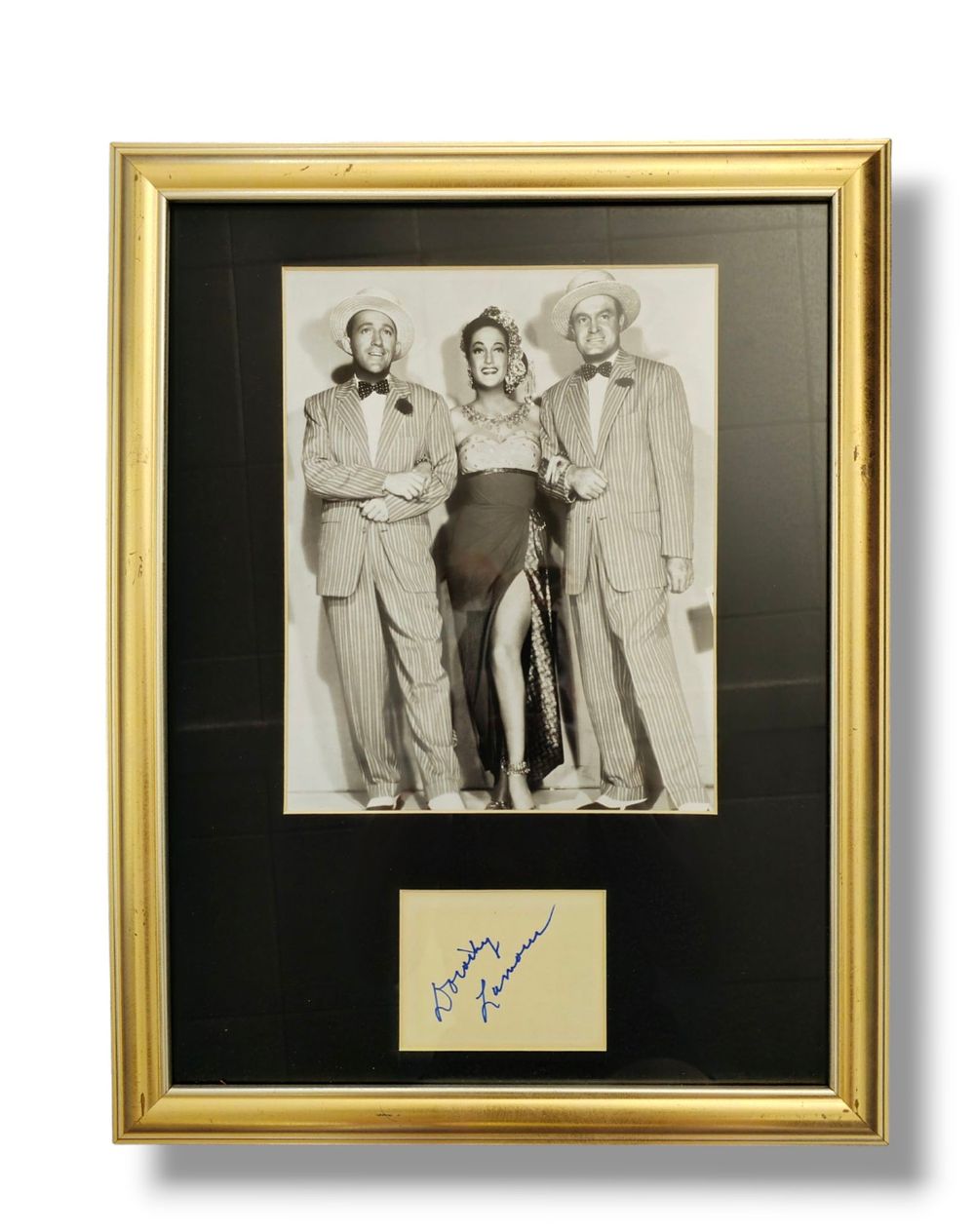 Lot 151: Dorothy Lamour 18x15 inch framed and mounted signature...