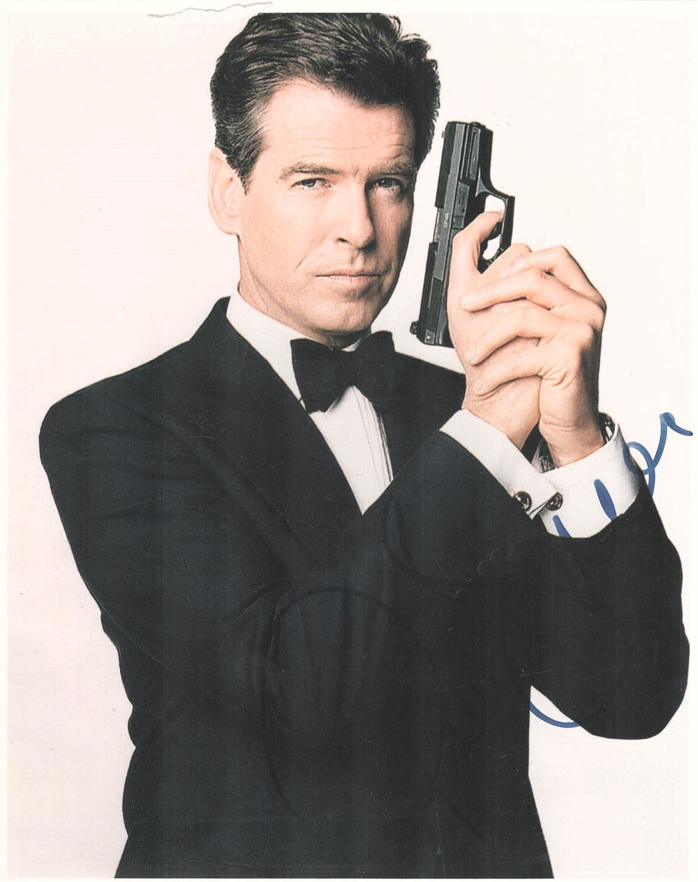 Lot 165: Pierce Brosnan signed 10x8 inch James Bond colour...