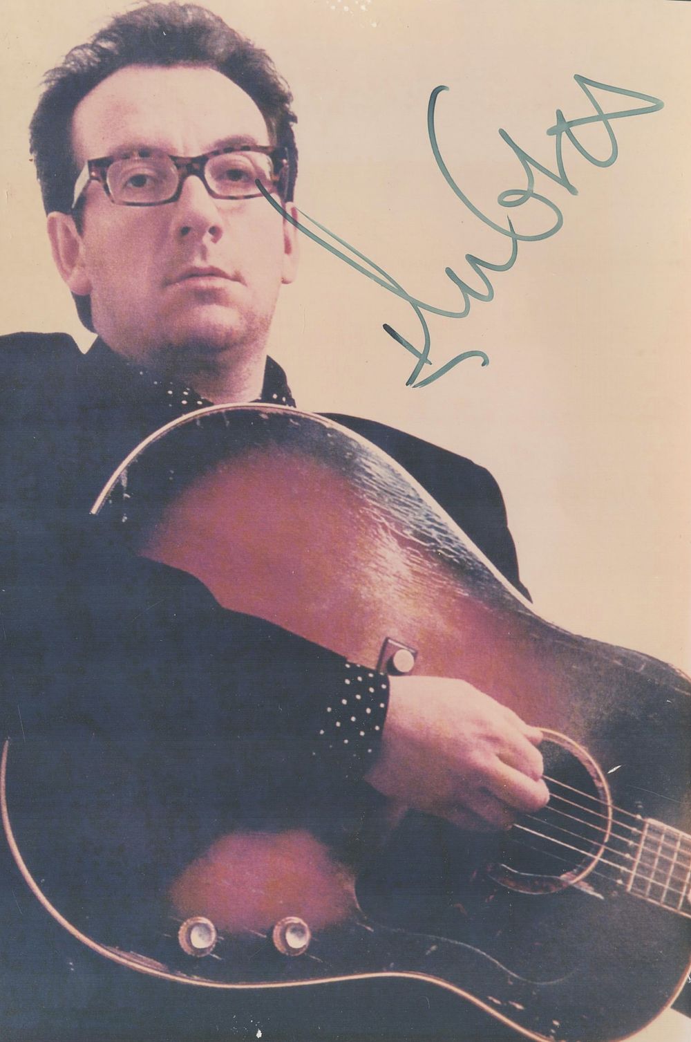 Lot 221: Elvis Costello signed 10x7 inch approx colour photo....