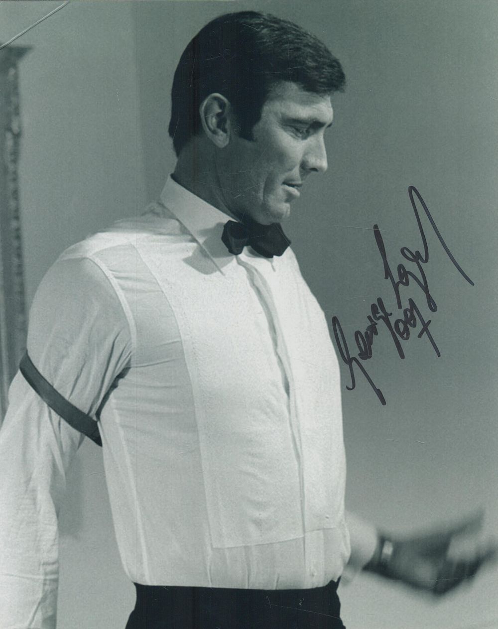 Lot 86: George Lazenby signed 10x8 inch black and white...