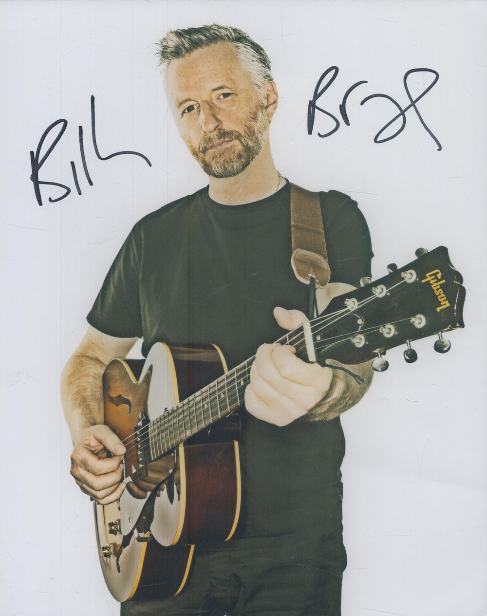 Lot 148: Billy Bragg signed 10x8 inch colour photo. Musician....