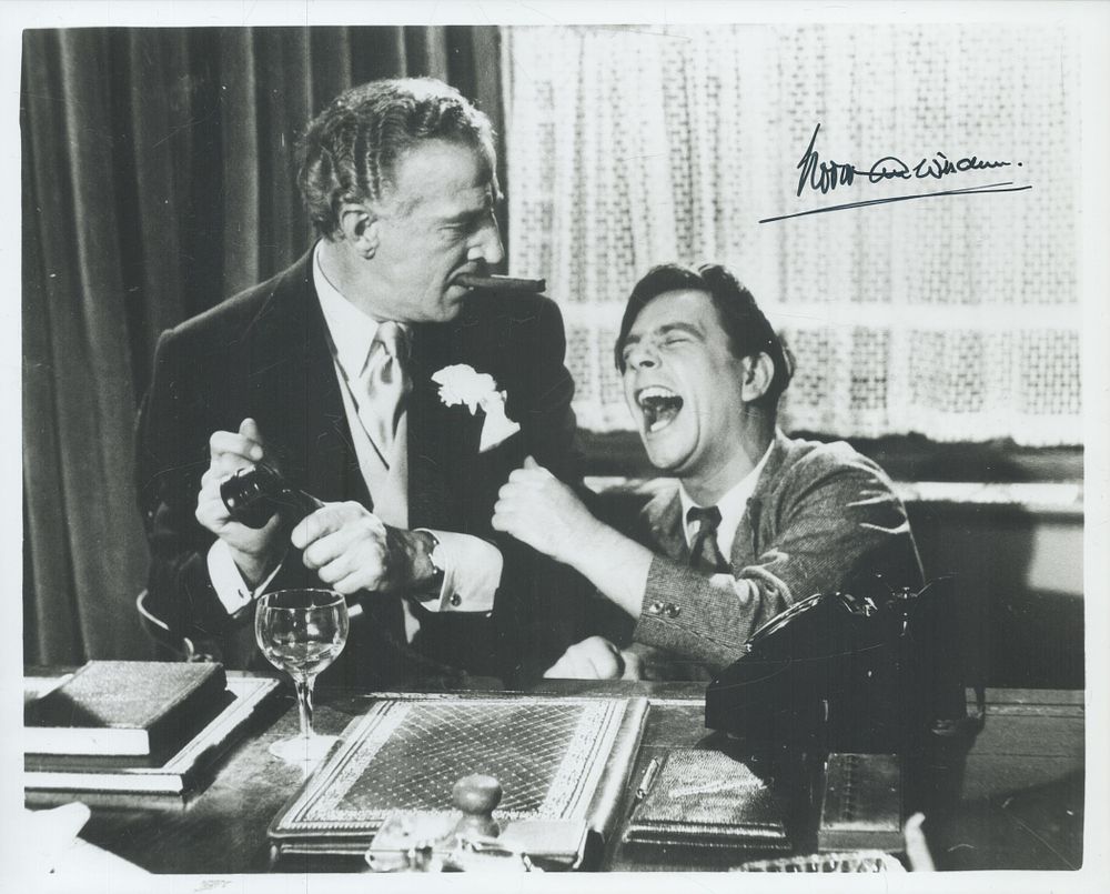 Lot 186: Norman Wisdom signed 10x8inch black and white photo....