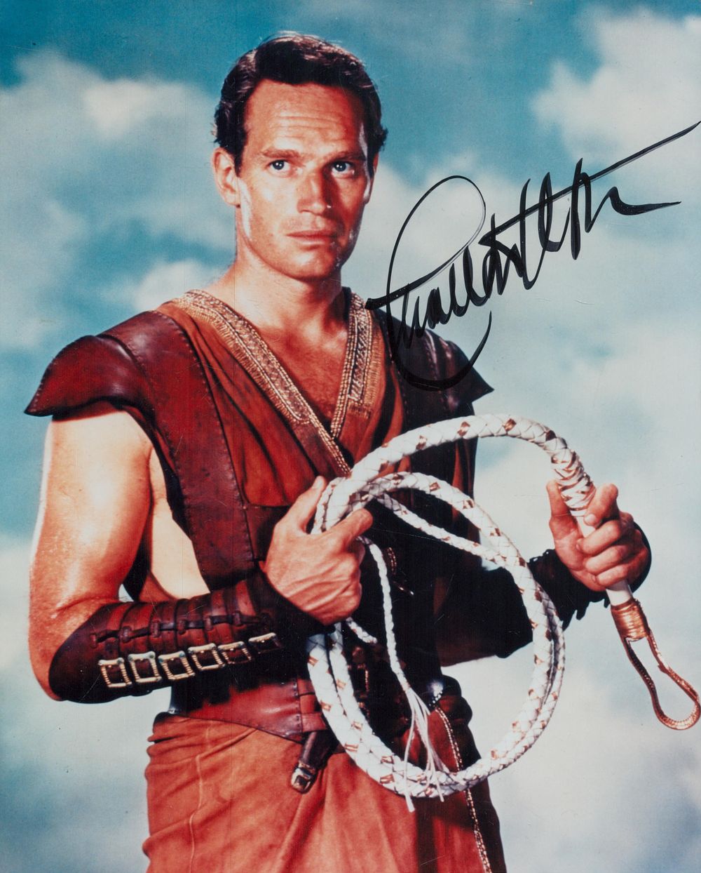 Lot 329: Charlton Heston signed 10x8 inch black and white...