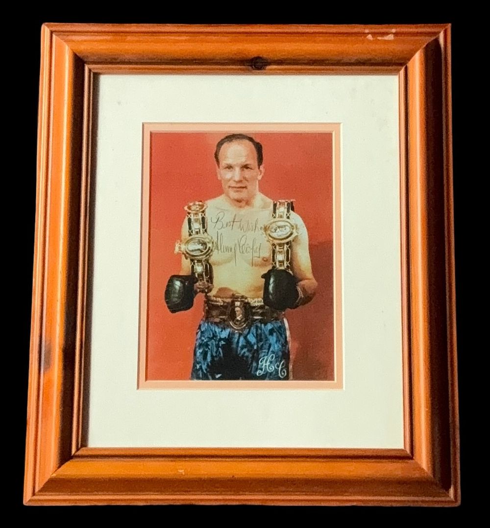 Lot 603: Henry Cooper signed colour photo. Mounted and framed...