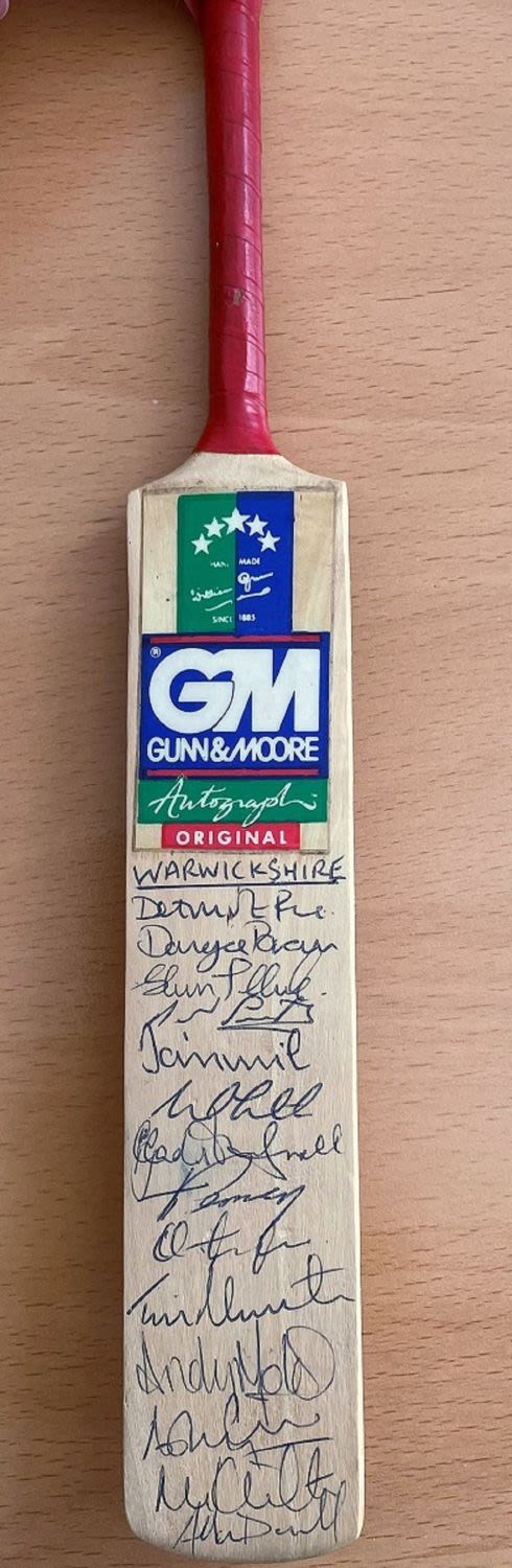 Lot 159: A Mini Gunn and Moore Cricket Bat Signed...