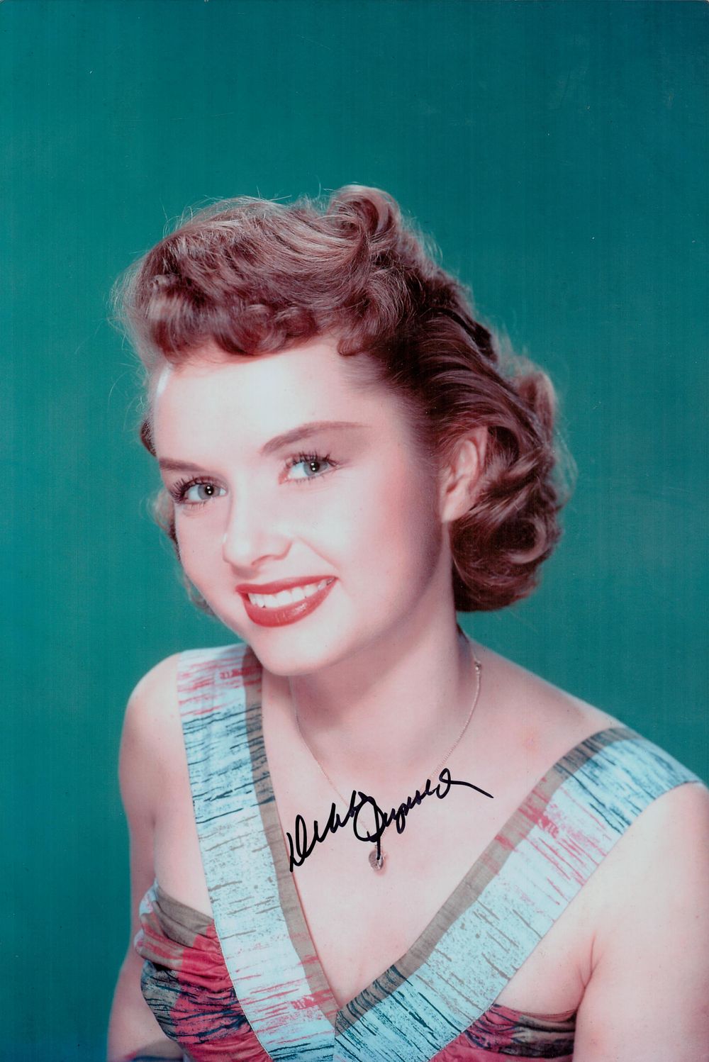 Lot 670: Debbie Reynolds signed 12x8inch colour photo. Good condition....