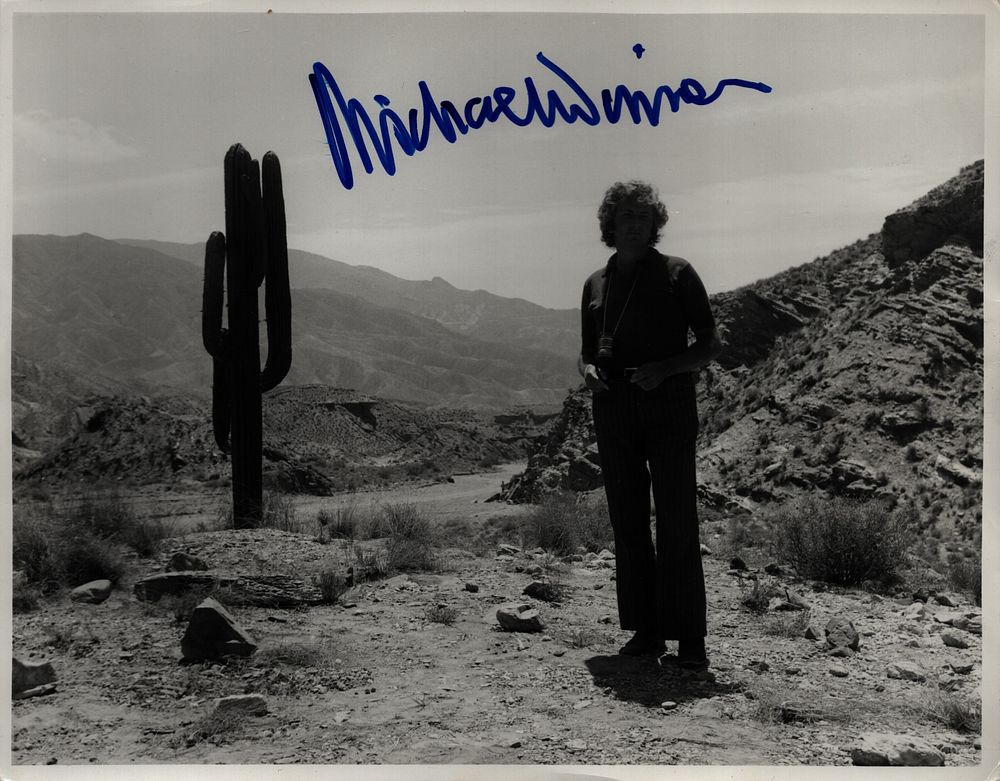 Lot 256: Michael Winner signed 10x8inch black and white photo....