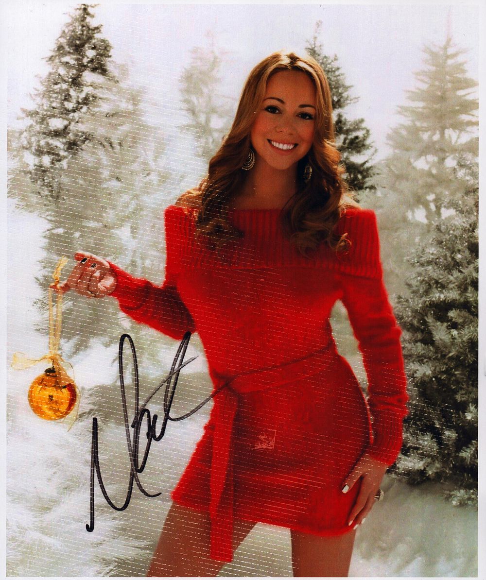 Lot 357: Mariah Carey 10x8inch colour photo. Printed signature. Good...