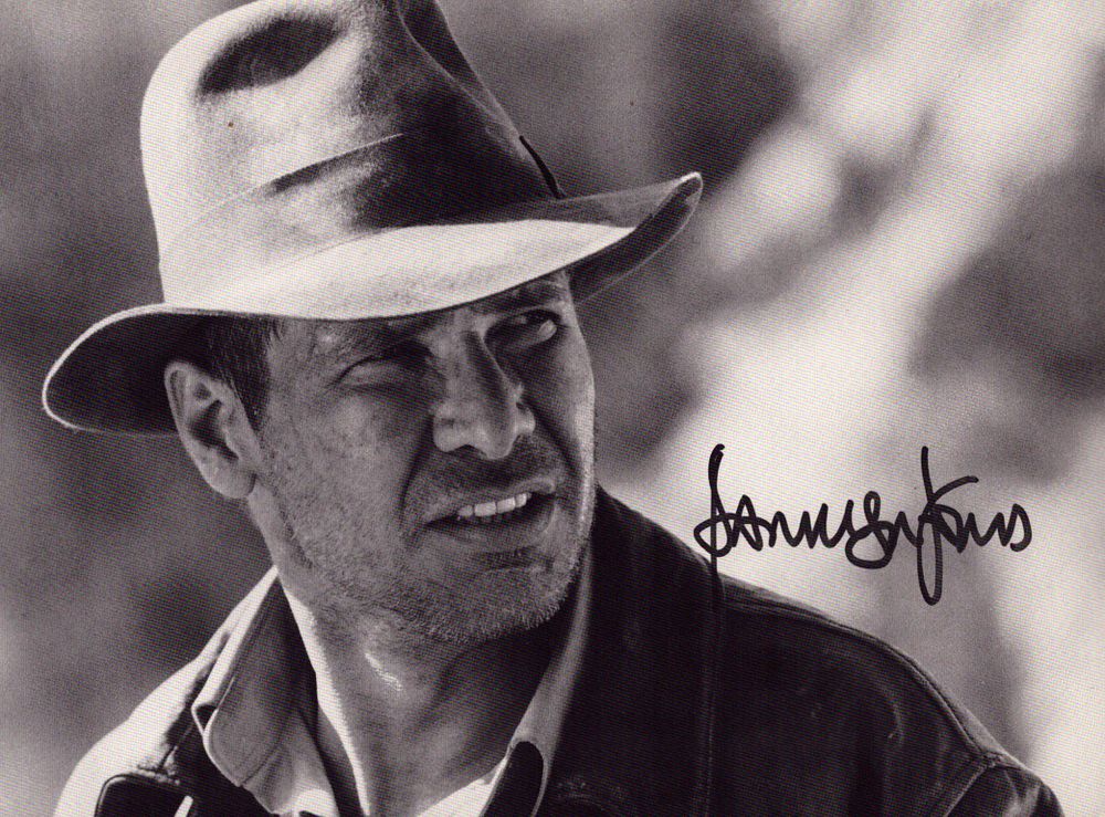 Lot 561: Harrison Ford signed 7x5 inch black and white...
