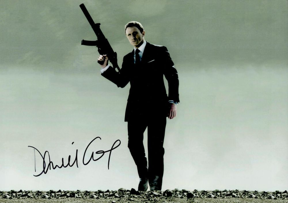 Lot 54: Daniel Craig signed Spectre 12x8 colour photo. Daniel...