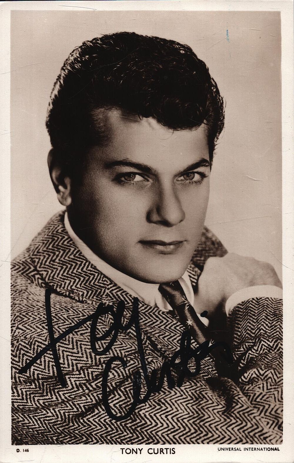 Lot 233: Tony Curtis signed 6x4inch black and white photo....