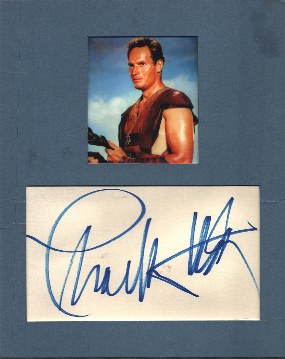 Lot 479: Charlton Heston signed white card mounted below colour...