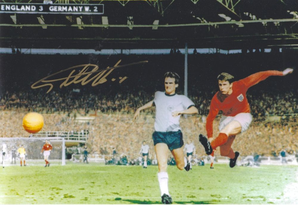Lot 331: Geoff Hurst signed 12x8 colour photo pictured scoring...