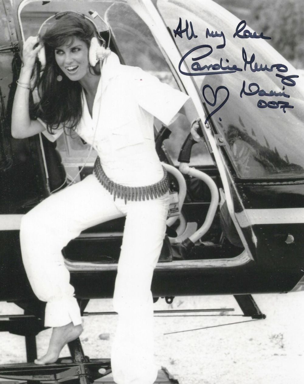 Lot 332: Caroline Munro signed 10x8 black and white photo...