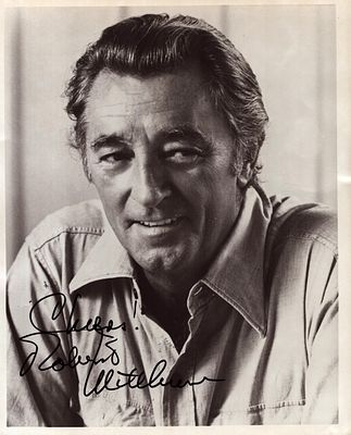 Robert Mitchum (1917-1907), a signed 10x8 inch photo. An American actor who appeared in over