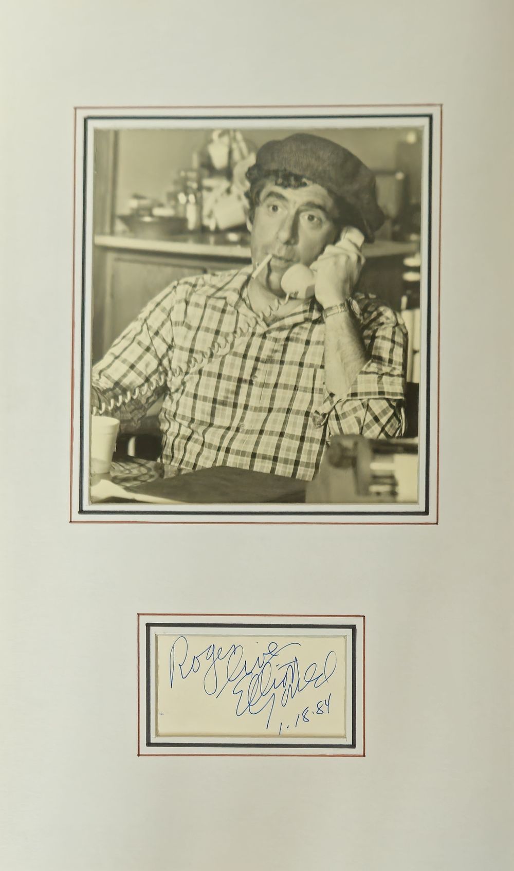 Lot 240: Elliott Gould signature piece mounted below black and...