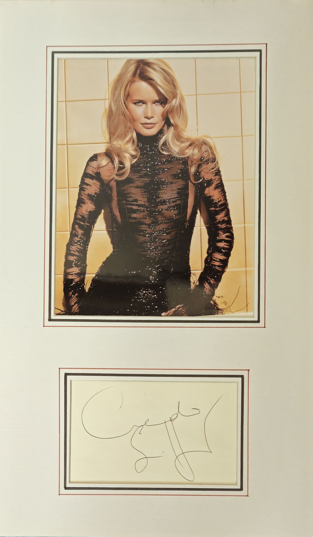 Lot 242: Claudia Schiffer signature piece mounted below colour photo....