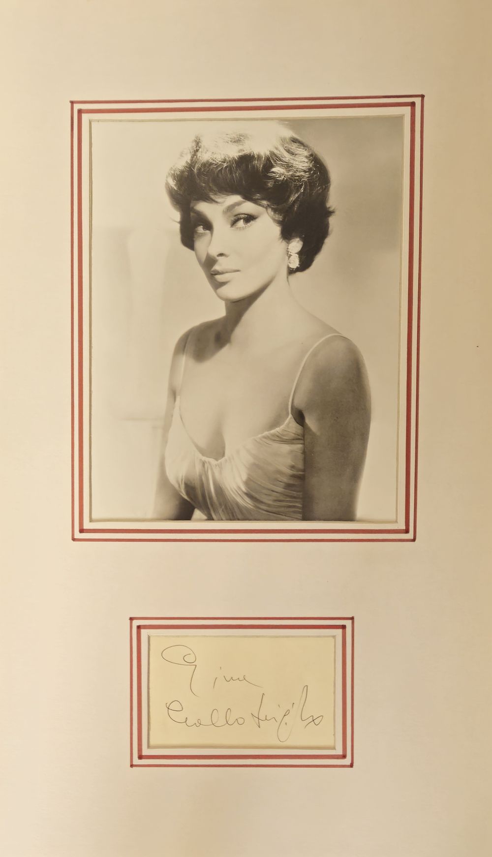 Lot 252: Gina Lollobrigida signature piece mounted below black and...