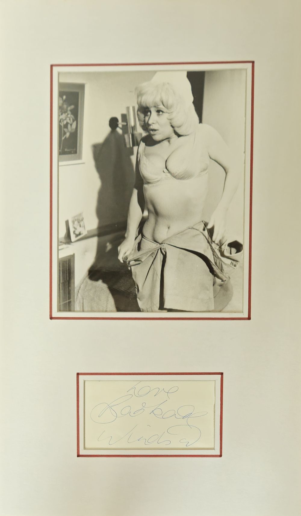 Lot 254: Barbara Windsor signature piece mounted below black and...