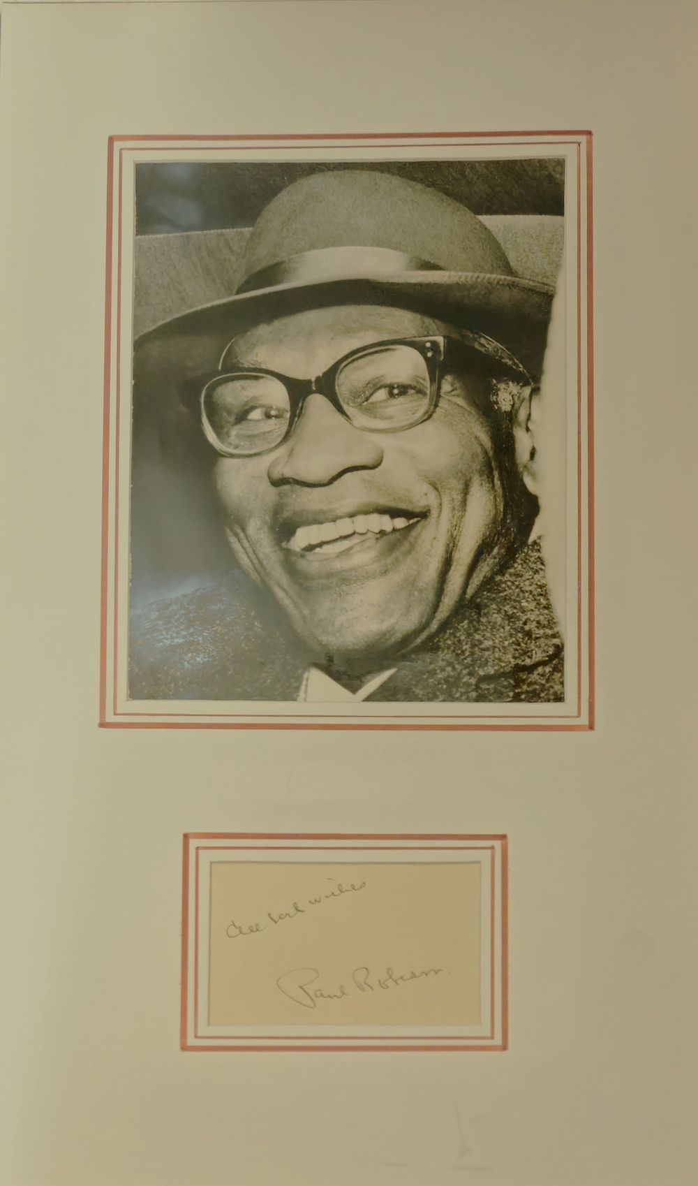 Lot 260: Paul Robeson signature piece mounted below colour photo....