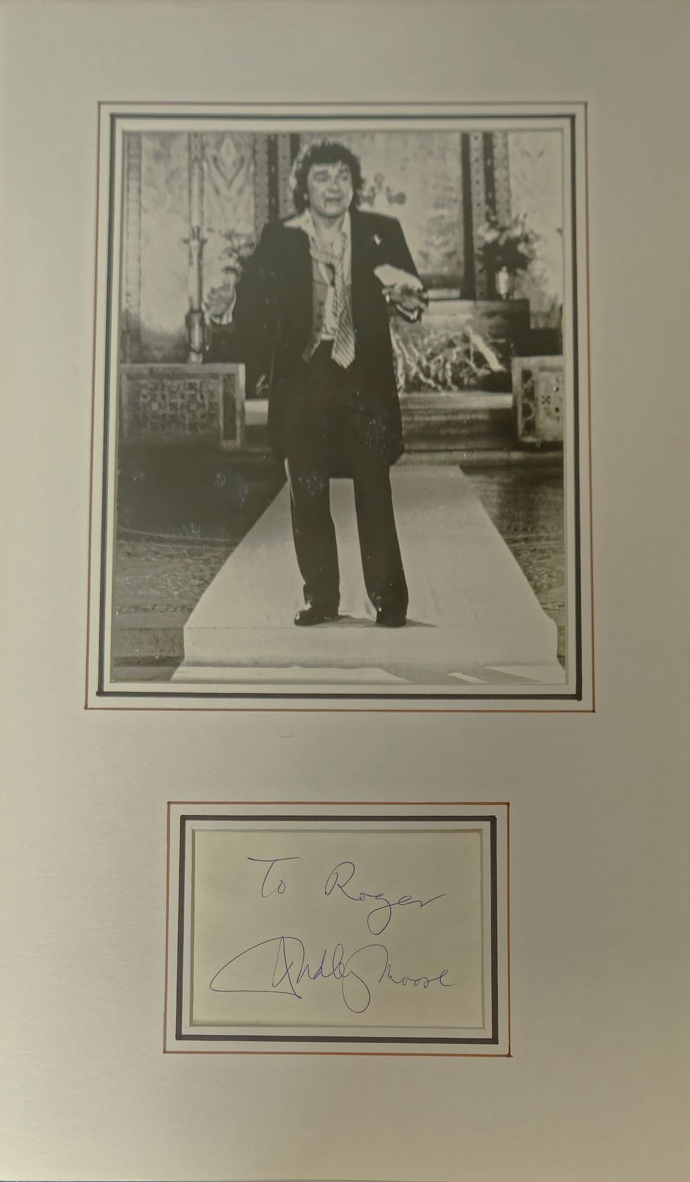 Lot 267: Dudley Moore signature piece mounted below black and...