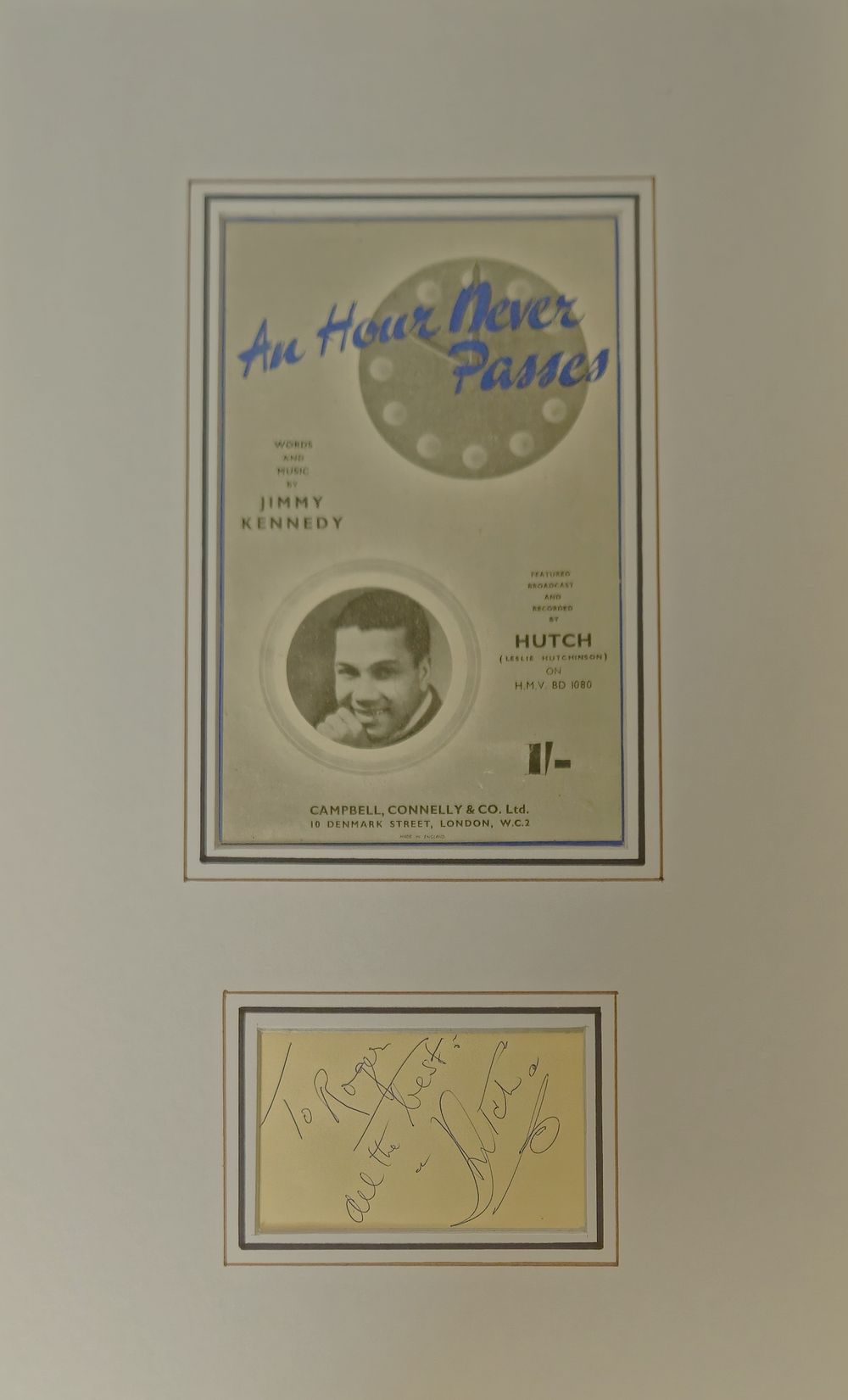 Lot 268: Leslie Hutchinson signature piece mounted below black and...