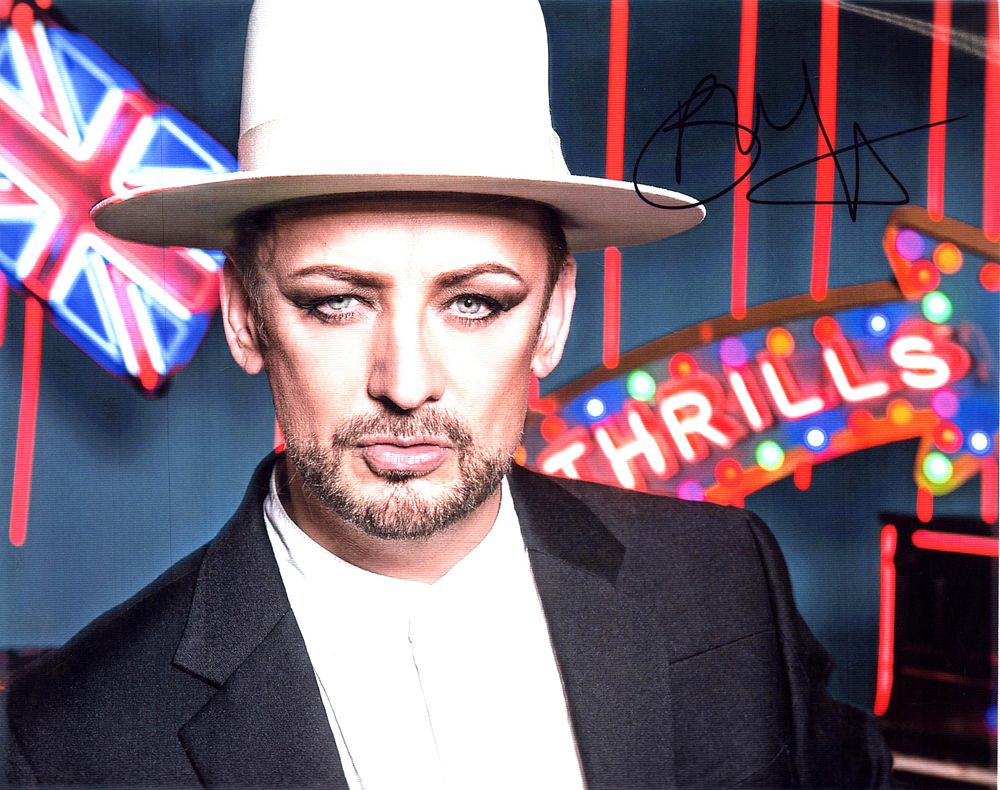 Lot 446: Boy George signed 10x8inch colour photo. Good condition....