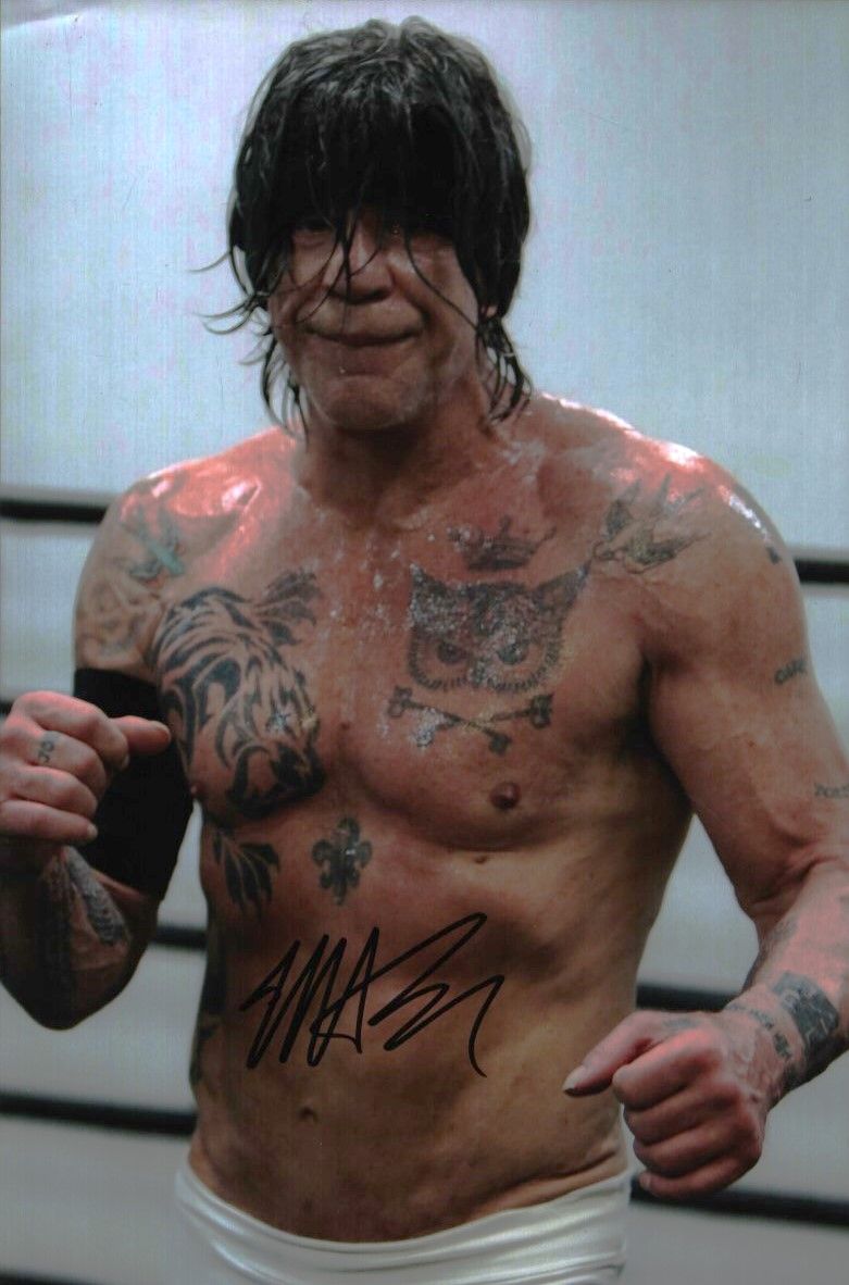 Lot 459: Mickey Rourke signed 10x8inch colour photo. Good condition....