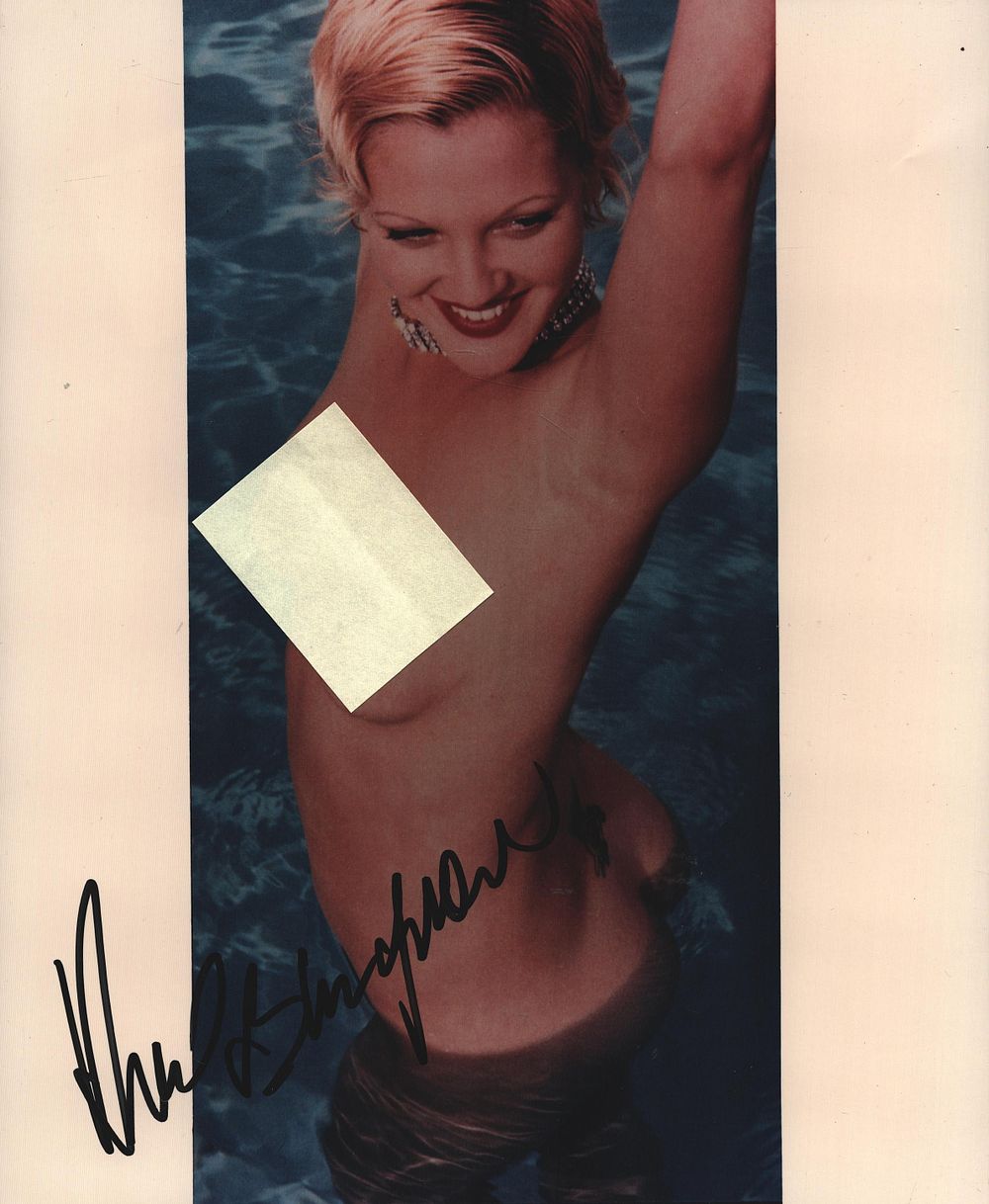 Lot 455: Drew Barrymore signed 10x8inch colour risque photo.