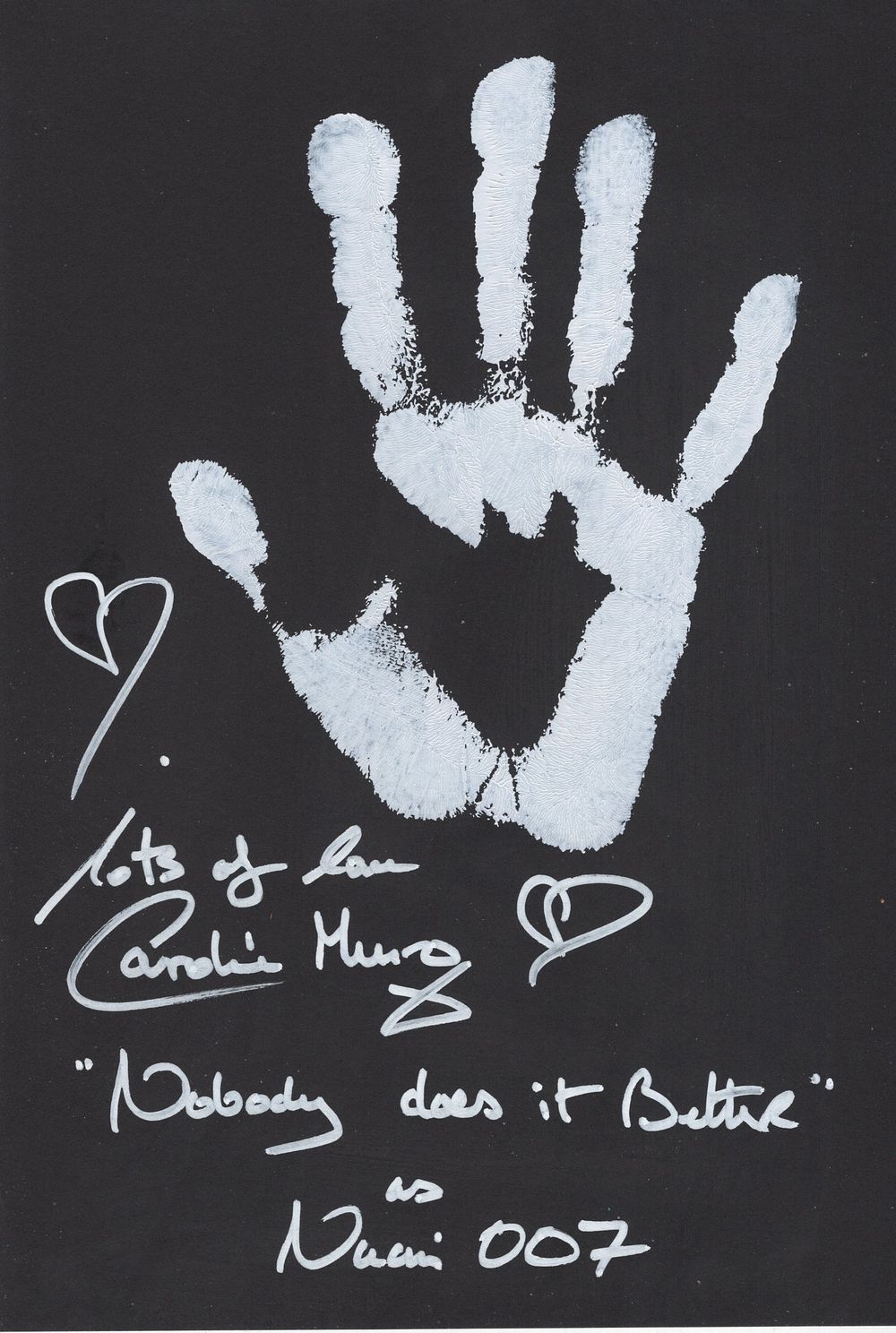 Lot 601: Caroline Munro personally applied handprint on 8x12 card,...