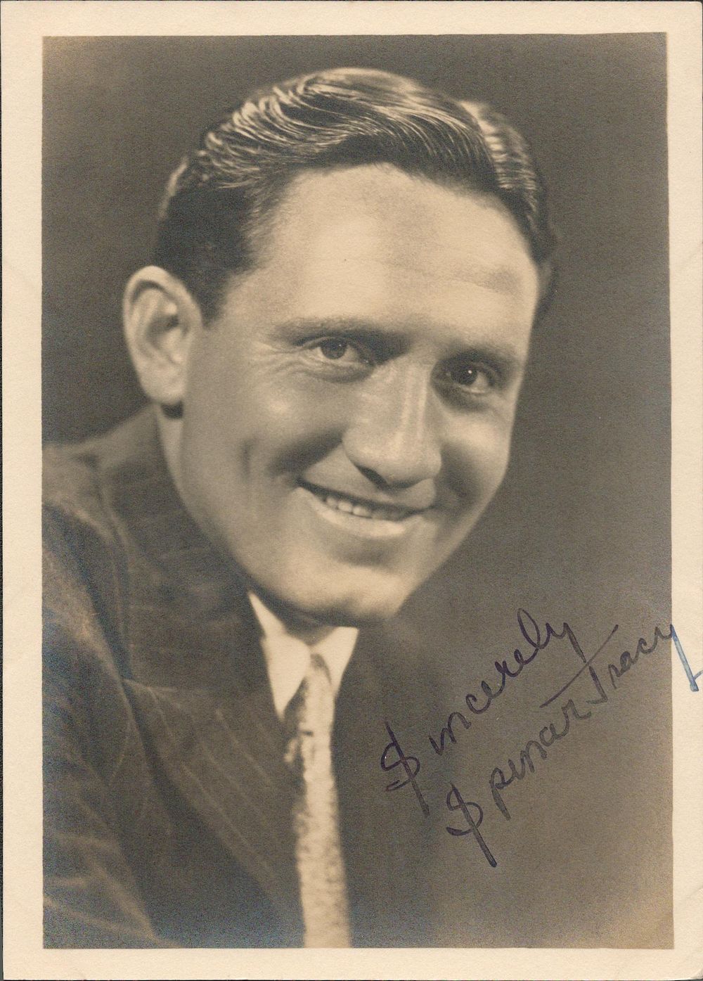 Lot 198: Spencer Tracy signed 7x5inch vintage photo. Good condition....