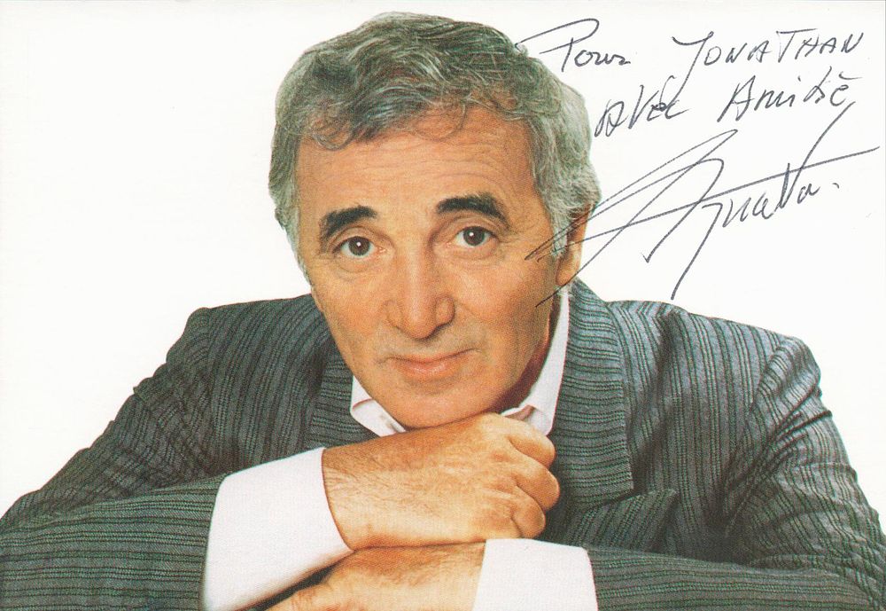 Lot 342: Charles Aznavour signed 6x4 inch colour photo. Dedicated....