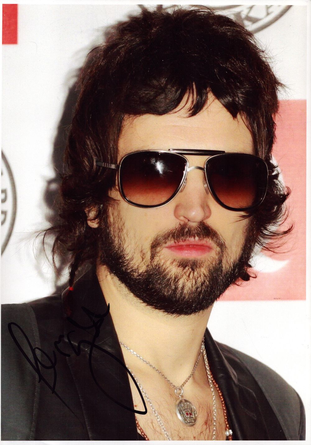 Lot 289: Serge Pizzorno (Kasabian) signed 12x8inch colour photo.