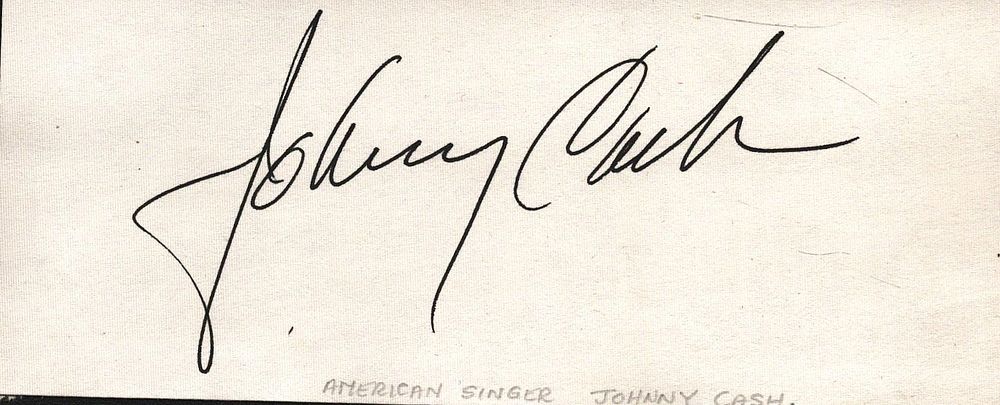 Lot 194: Johnny Cash signed signature piece 5x2 inch Approx....
