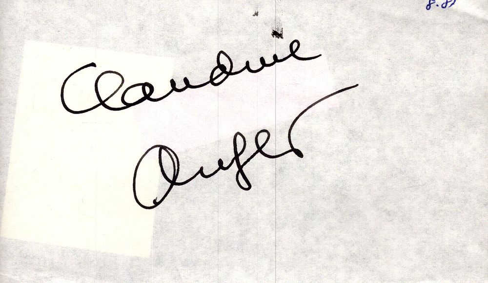 Lot 210: Claudine Auger signed 5x3inch album page. Good condition....