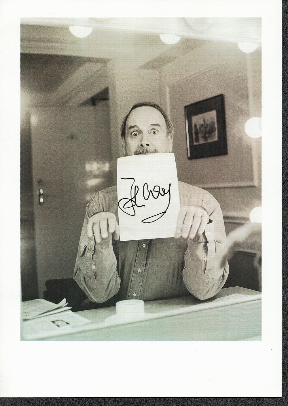 Lot 553: John Cleese signed black and white photo card...