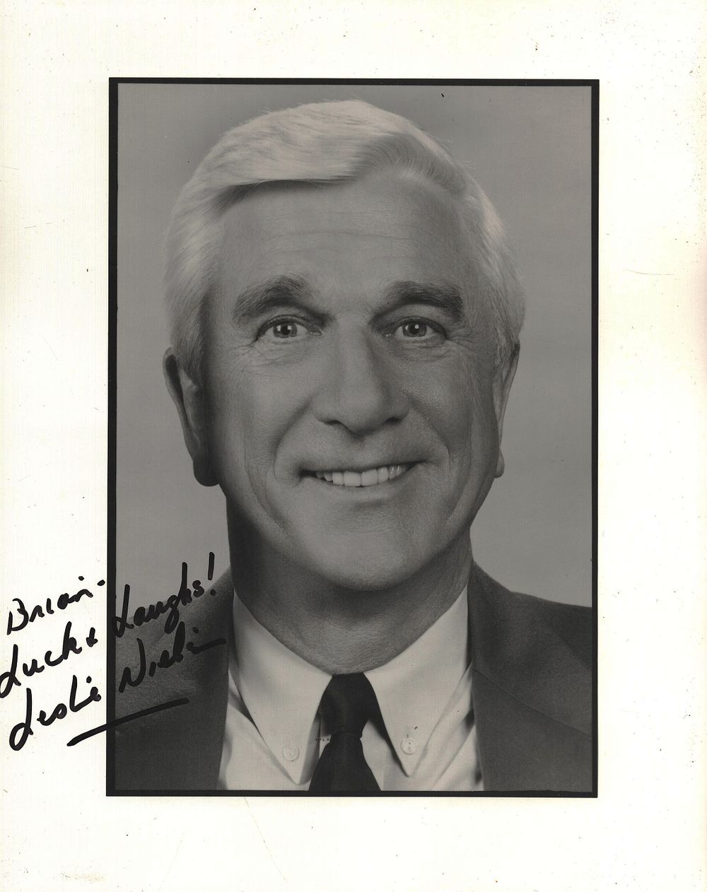 Lot 607: LESLIE NIELSEN (1926-2010) Actor signed 10x8 photo. Good...