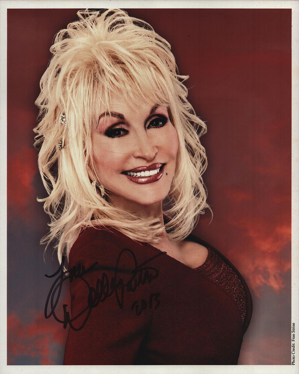 Lot 614: DOLLY PARTON Singer signed 8x10 Photo. Good condition....